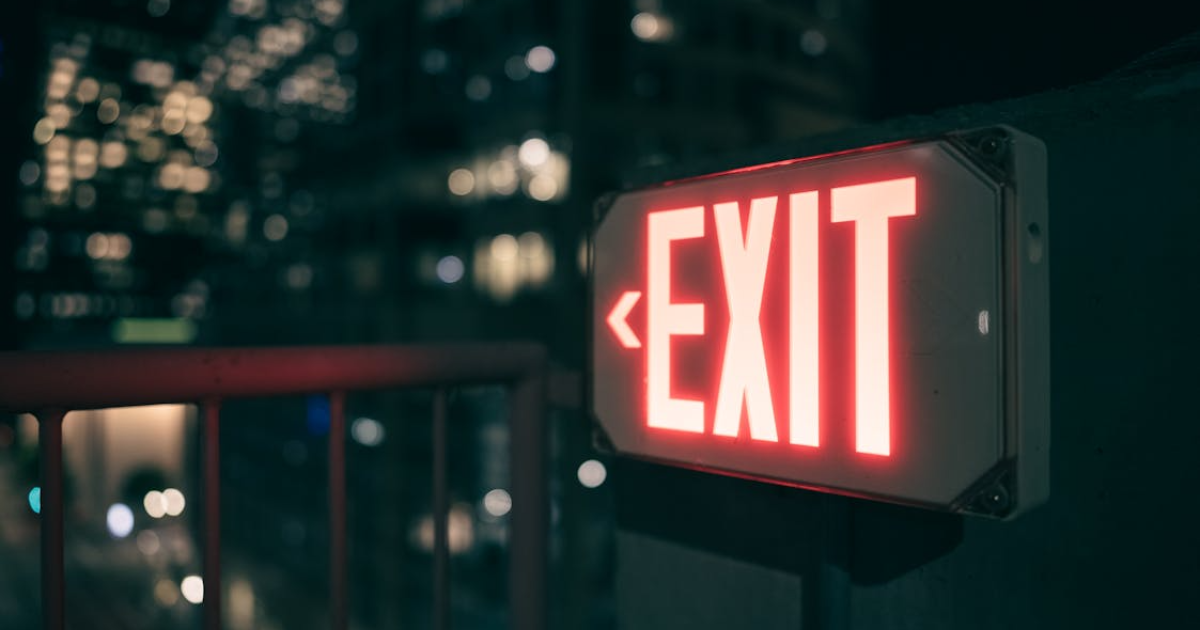Emergency exit signs in a residential building highlighting safety preparedness.