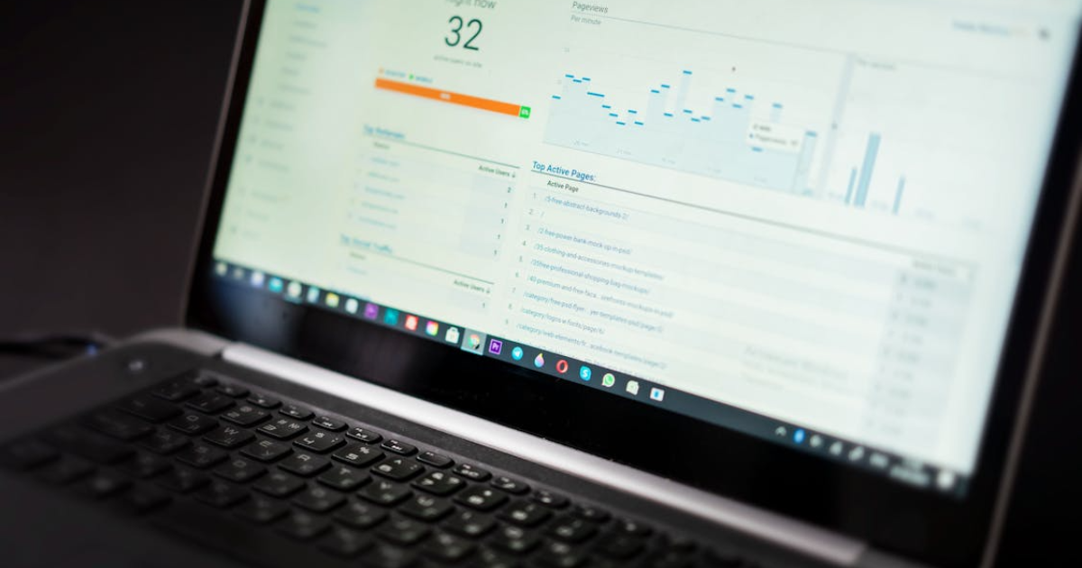 Laptop screen showing rental market charts and graphs for real estate investment analysis.
