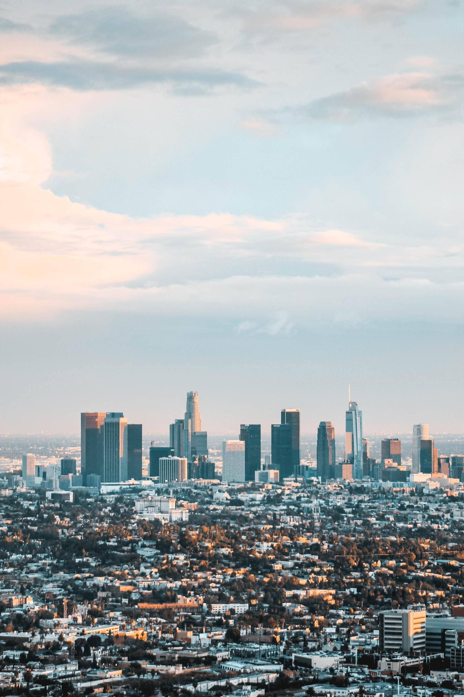 Los Angeles skyline beneath a cloudy sky.