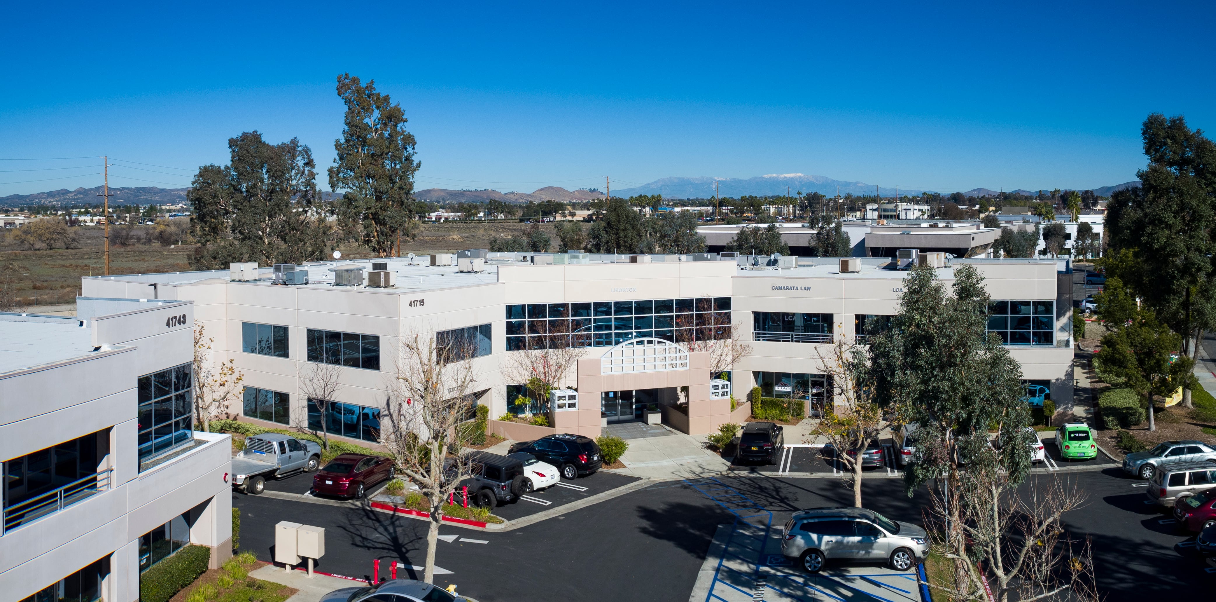 Aerial view of Enterprise Court office buildings, landscaping, and parking.